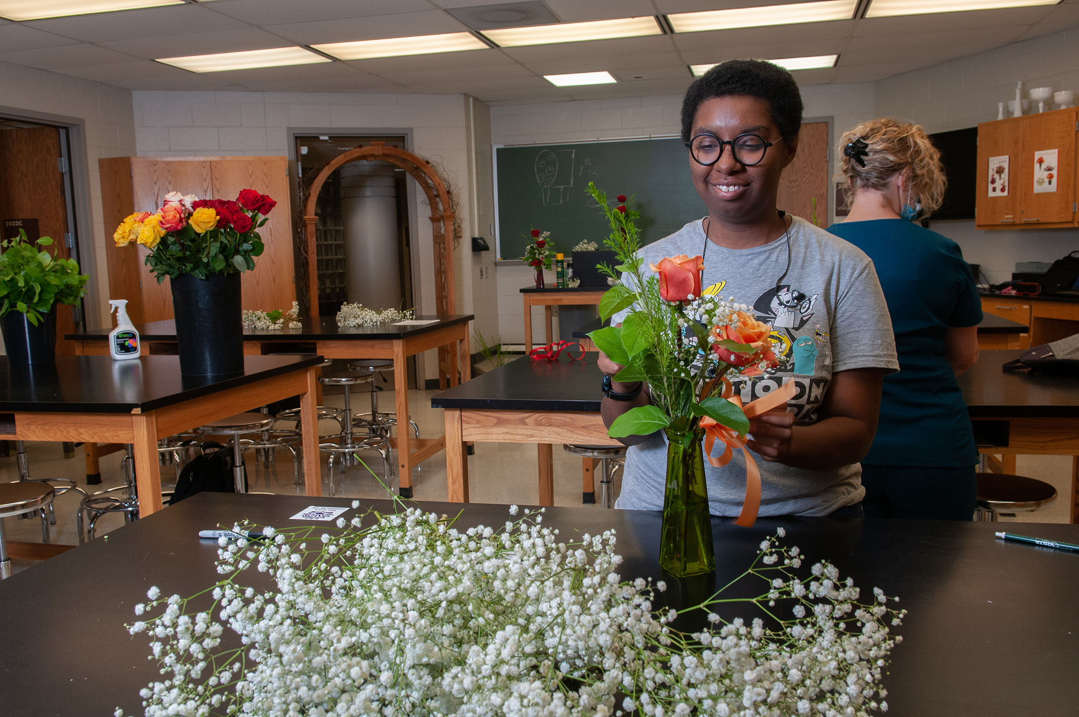 Student in floral design class