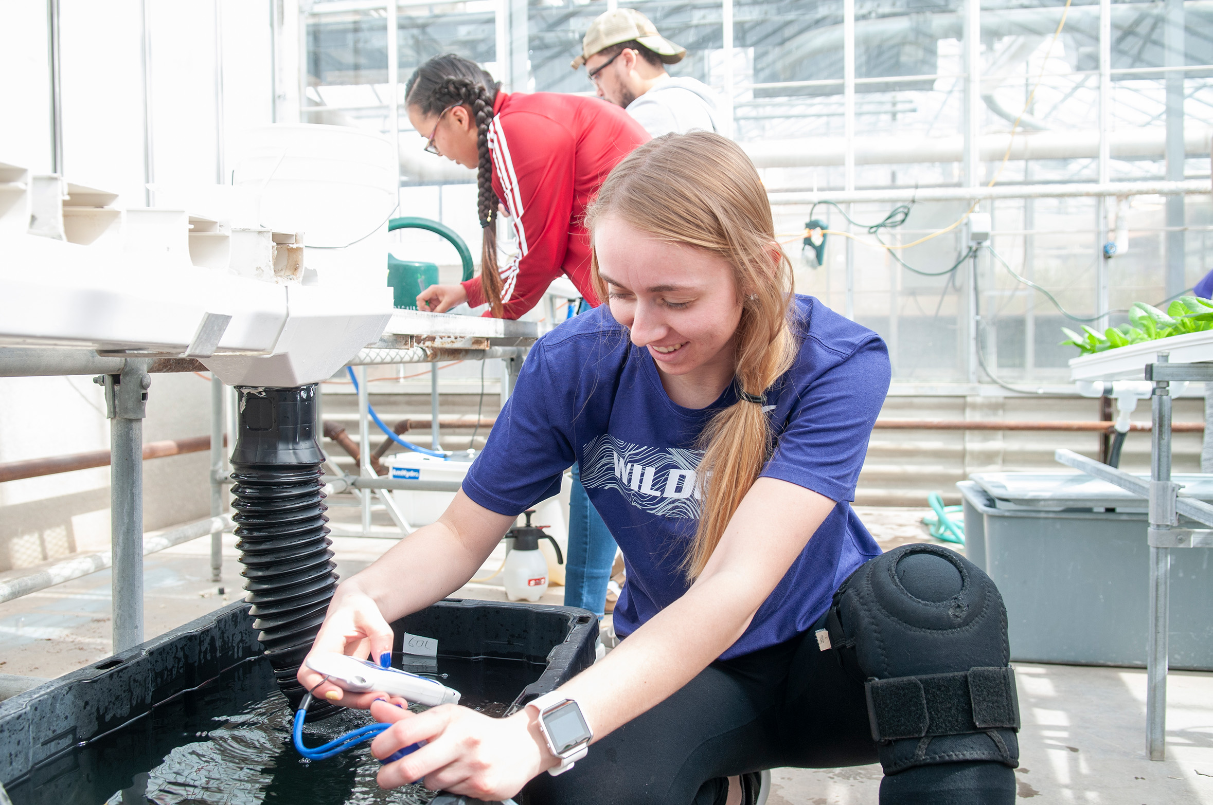 Student in greenhouse